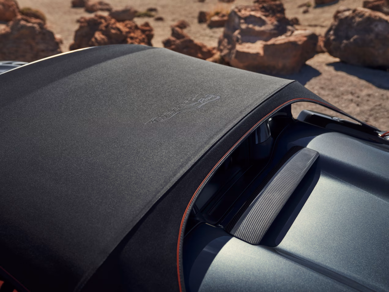 View of the hood of the Porsche 718 Spyder RS in Vanadium Grey Metallic.