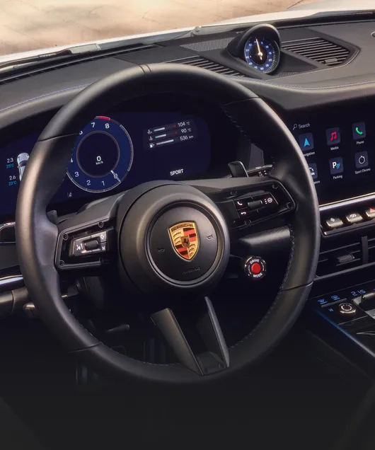 Detailed view of the GT sports steering wheel in the cockpit of the Porsche 911 Carrera T.
