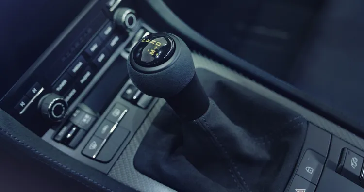 Detailed view of the 7-speed Porsche Doppelkupplung (PDK) on the Porsche 718 Cayman GT4 RS. 