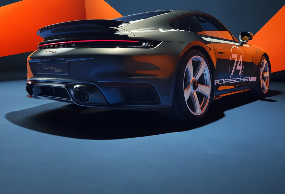 The Porsche 911 Turbo 50 Years with Heritage Design package is shown from the side and from behind. 