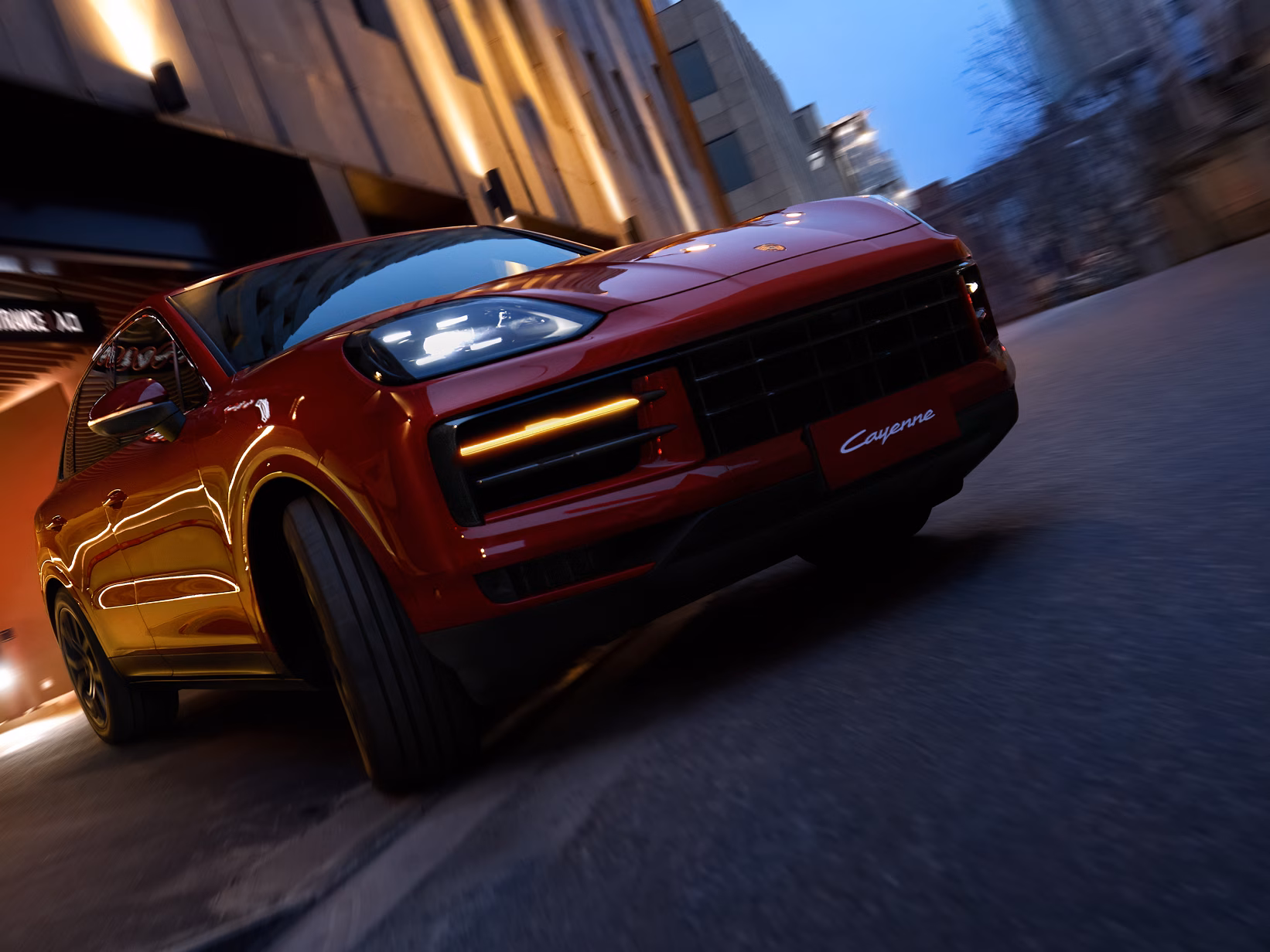 View of the rear end of the Porsche Cayenne Passion in Carmine Red.