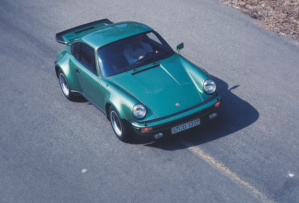 Top view of the front and side of a Porsche 911 Turbo (930) while driving.  