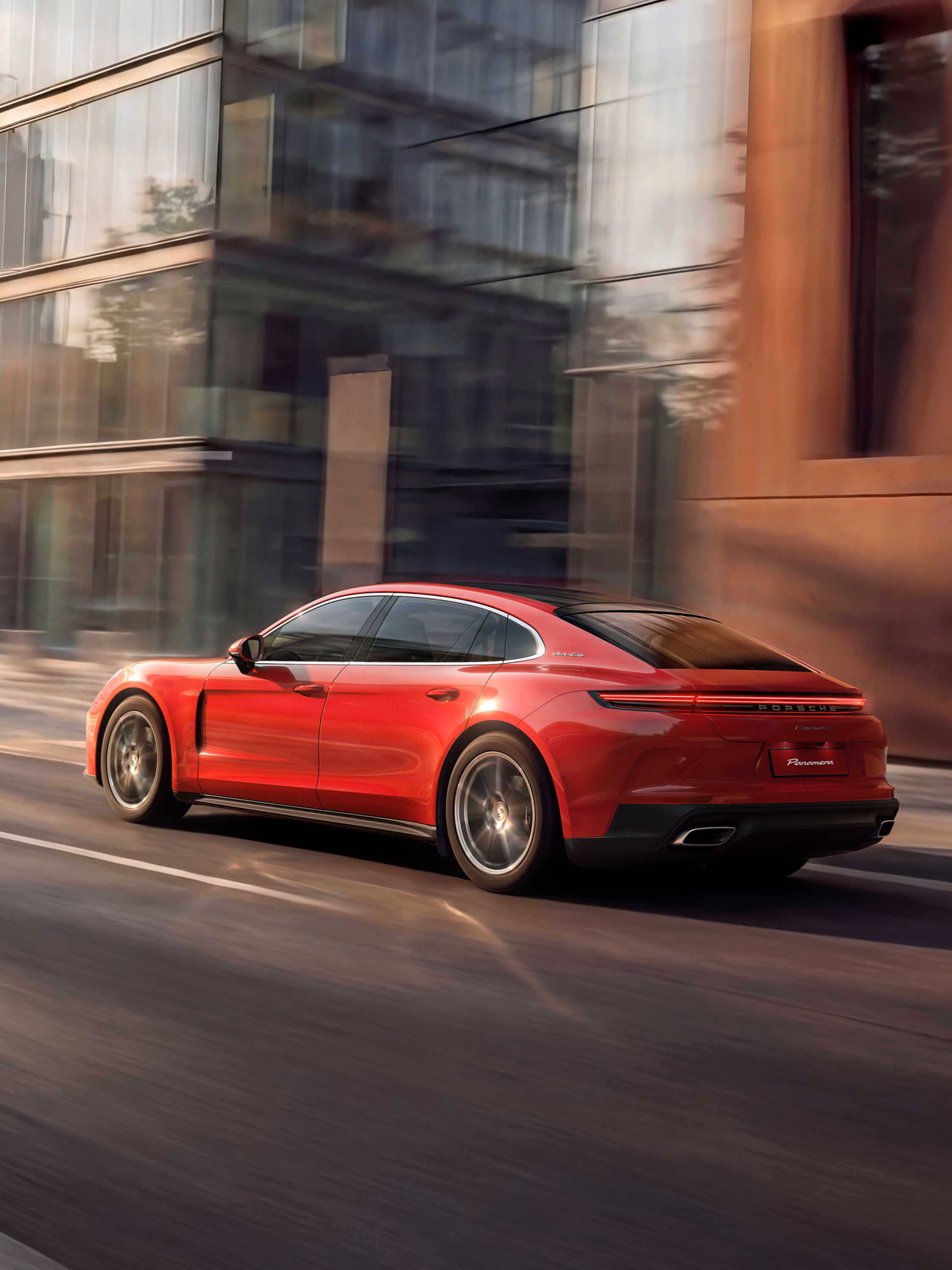 View of the rear of the Porsche Panamera 4 Executive Pure in Carmine Red.