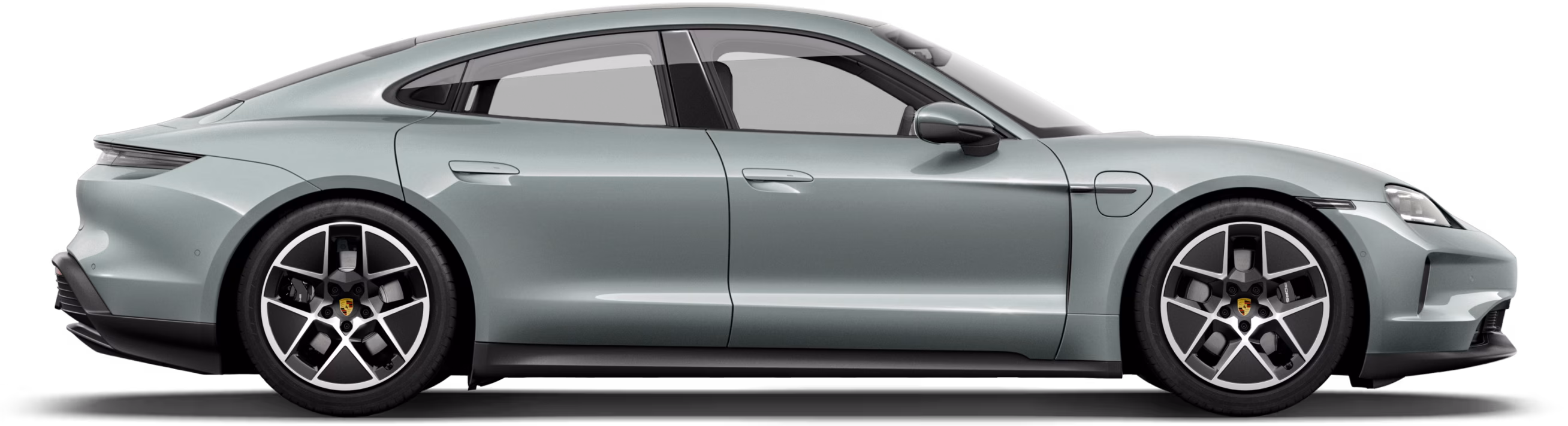 Porsche Taycan in Shade Green Metallic in profile / side view.