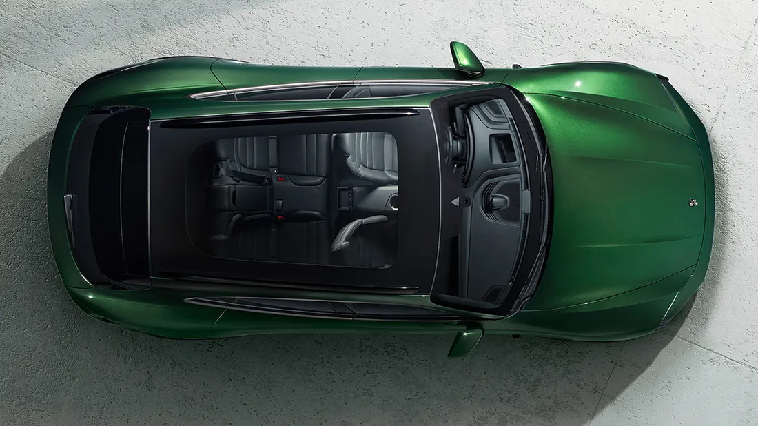 View from above / bird's eye view of Porsche Taycan Turbo Cross Turismo in Oak Green Metallic Neo.