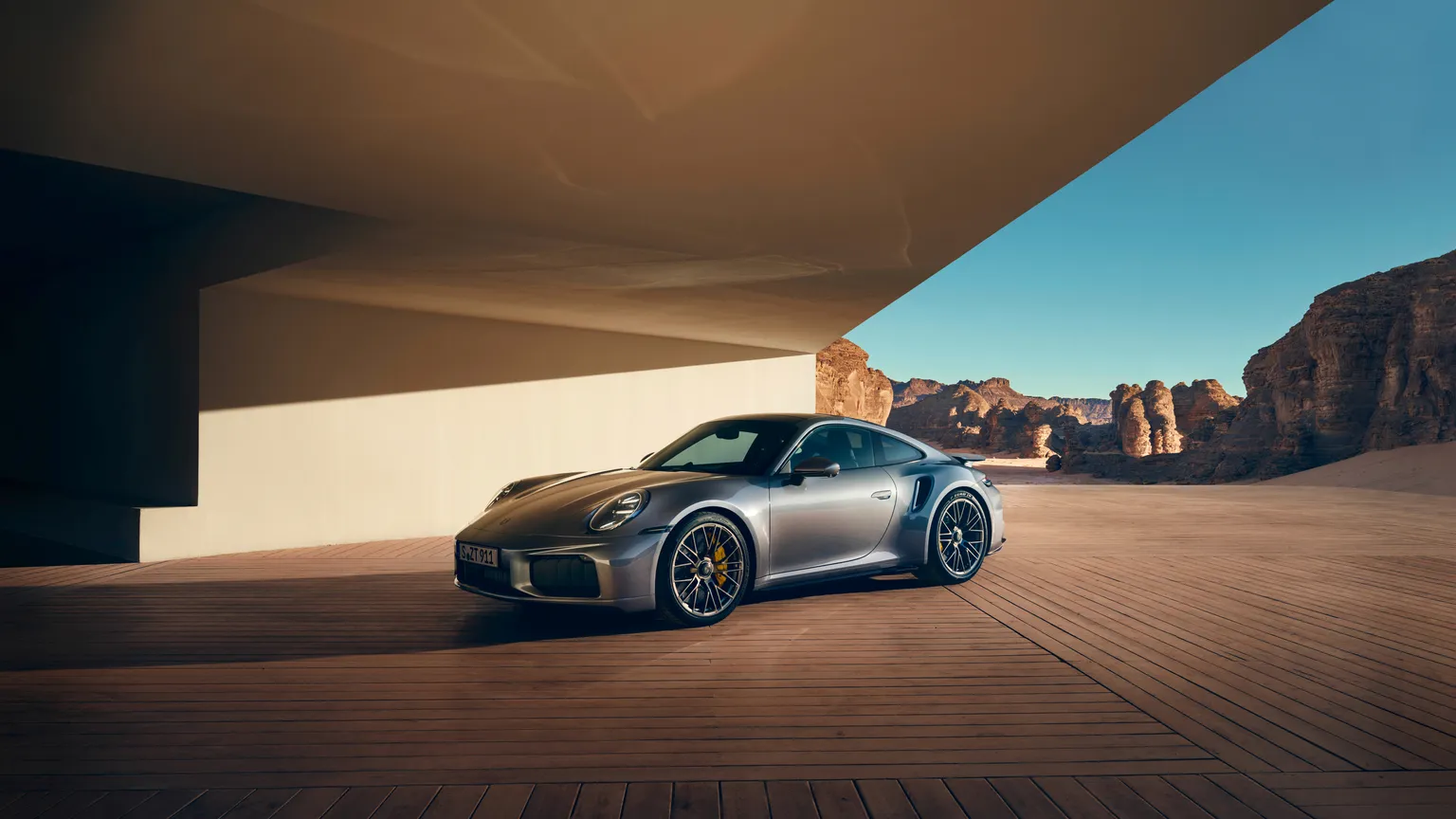 Front view of the Porsche 911 Turbo S in Vanadium Grey Metallic.