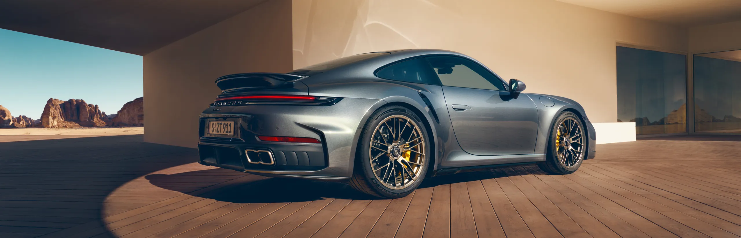 Side view of the Porsche 911 Turbo S in Vanadium Grey Metallic.