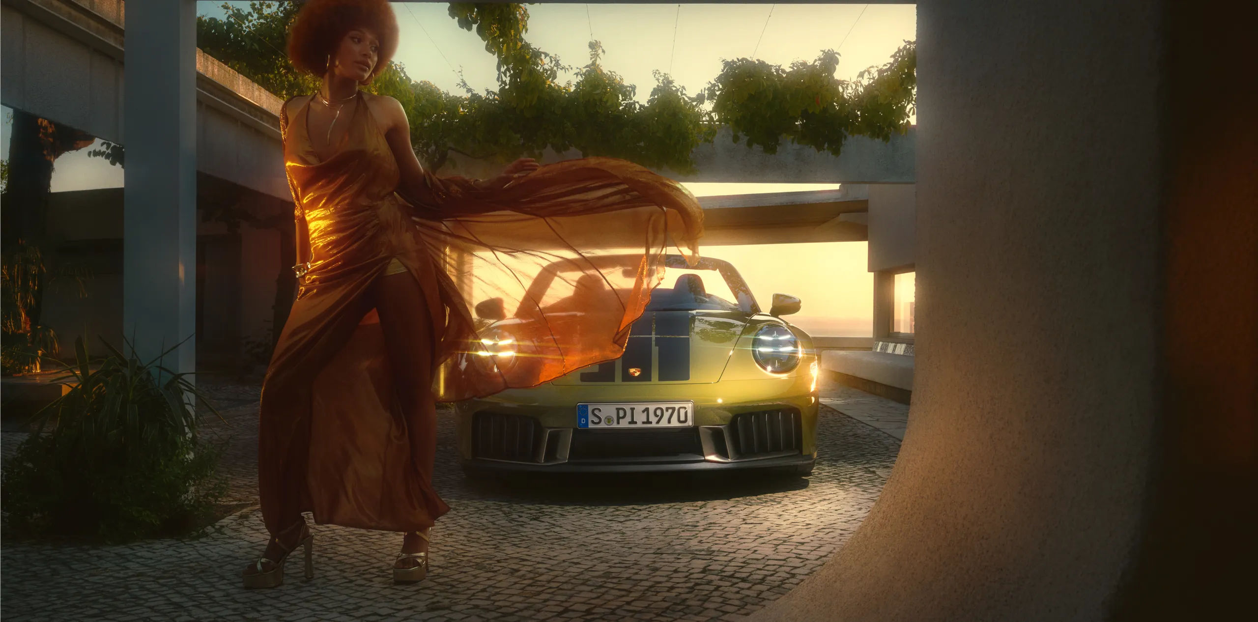 The Porsche 911 Turbo 50 Years in GT Silver Metallic is shown from the side and from the front.