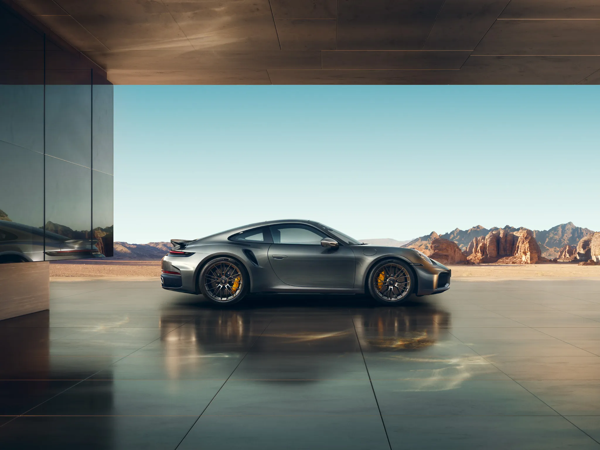 Rear view of the Porsche 911 Turbo S in Vanadium Grey Metallic.