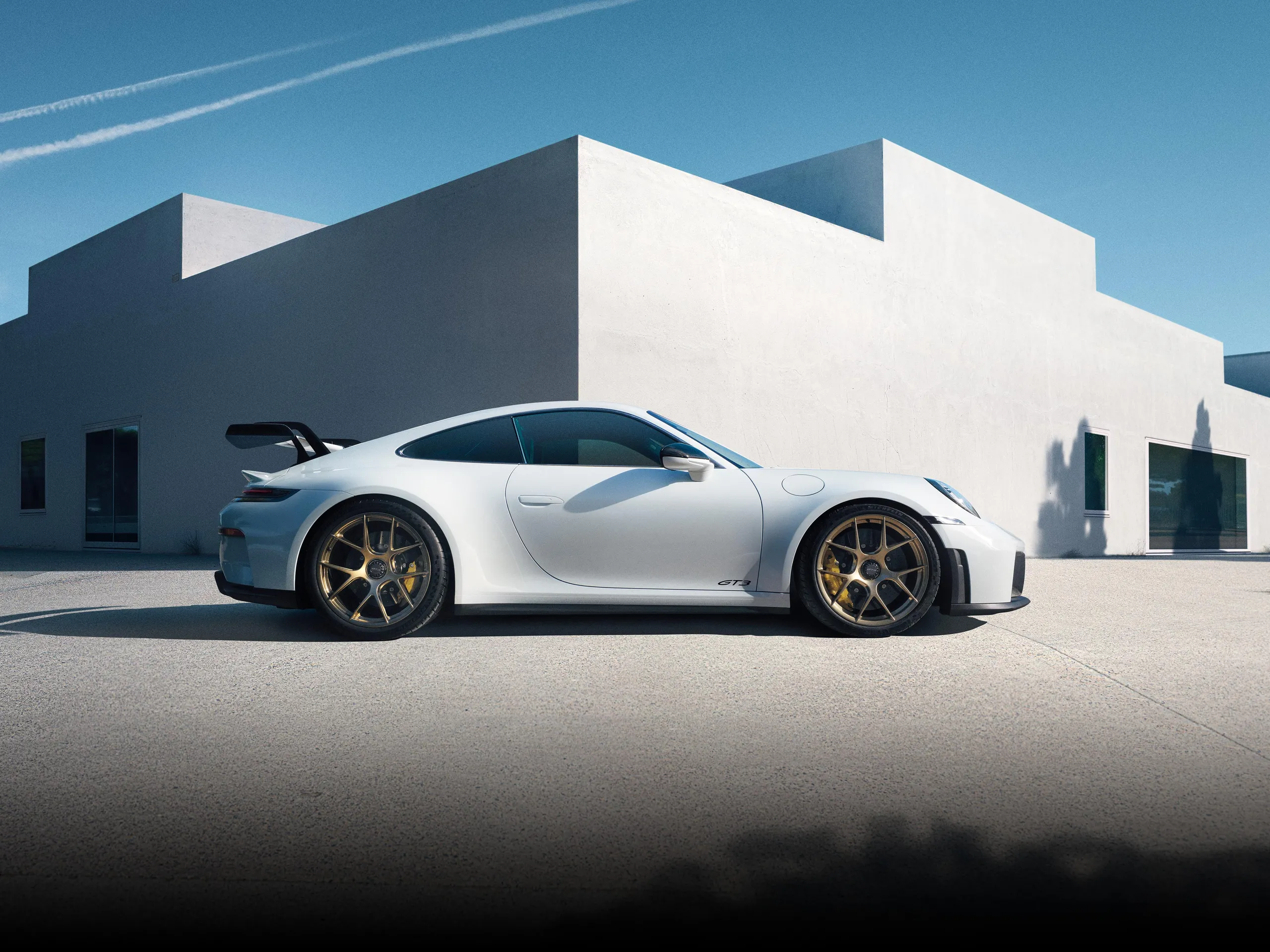 Side view of a Porsche 911 GT3 in White.